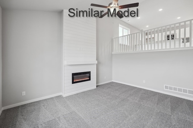 unfurnished living room with baseboards, visible vents, ceiling fan, carpet floors, and a fireplace