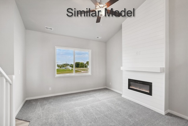 unfurnished living room featuring a fireplace, carpet flooring, visible vents, baseboards, and vaulted ceiling