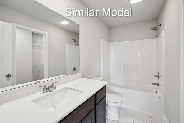 bathroom with toilet, tile patterned flooring, shower / bathing tub combination, and vanity