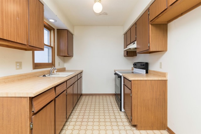 kitchen with black electric range, brown cabinetry, light countertops, and a sink