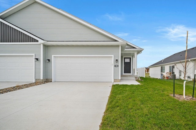 view of front facade with central air condition unit, board and batten siding, a garage, driveway, and a front lawn