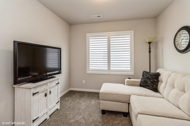 living room featuring carpet flooring, visible vents, and baseboards