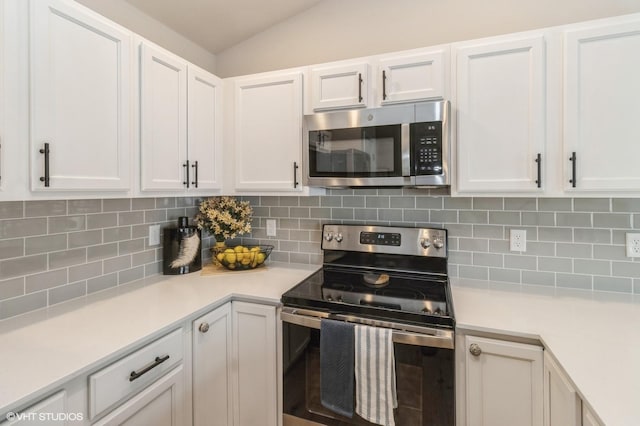 kitchen with light countertops, appliances with stainless steel finishes, and white cabinets