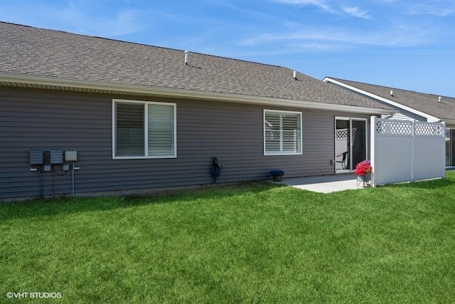 805 Cherry St NW, Bondurant, IA 50035 - back of property featuring a shingled roof, fence, and a yard