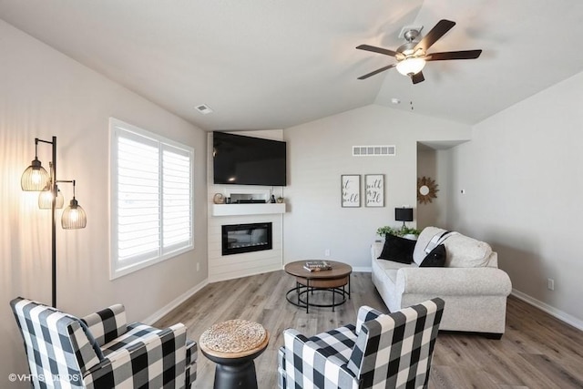 805 Cherry St NW, Bondurant, IA 50035 - living area featuring visible vents, wood finished floors, lofted ceiling, and a ceiling fan