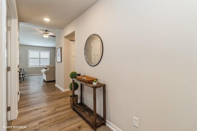 805 Cherry St NW, Bondurant, IA 50035 - hallway with baseboards and light wood-type flooring