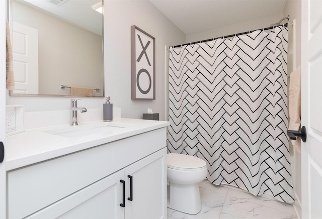 full bath featuring a shower with curtain, marble finish floor, vanity, and toilet