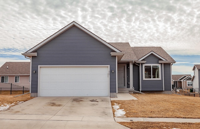 ranch-style house featuring concrete driveway, a shingled roof, an attached garage, and fence