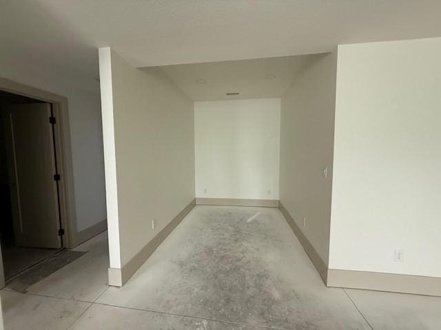 570 El Dorado Ct, Waukee, IA 50263 - empty room featuring baseboards and concrete floors