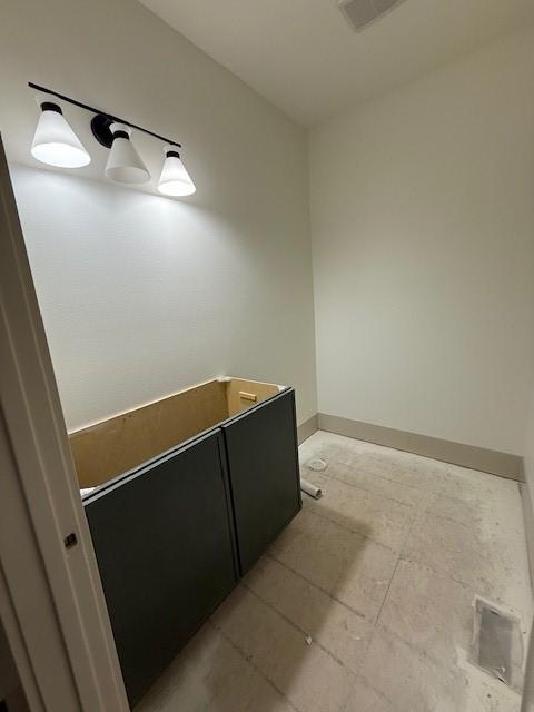 570 El Dorado Ct, Waukee, IA 50263 - bathroom featuring baseboards