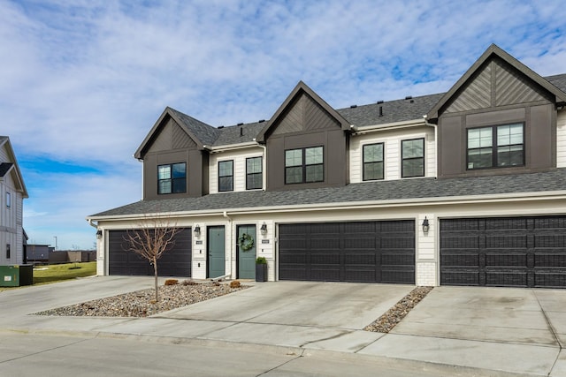 view of front of house with driveway, a garage, a shingled roof, central air condition unit, and brick siding