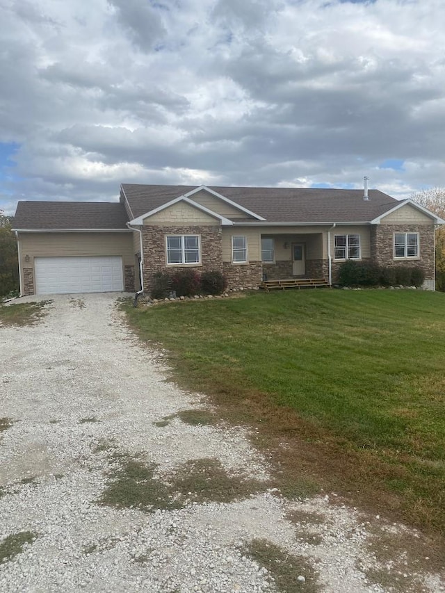 ranch-style house with a front yard, gravel driveway, and an attached garage