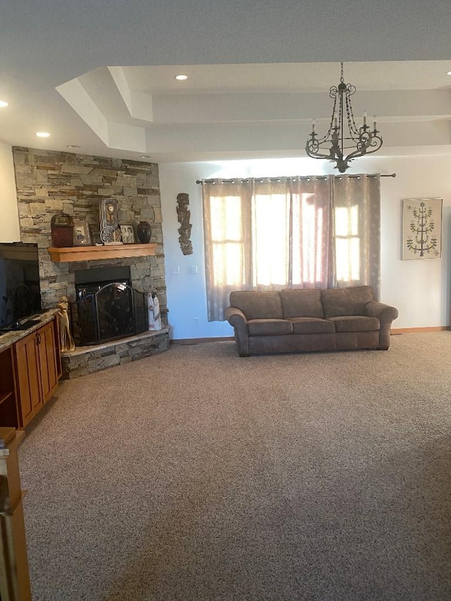 carpeted living area featuring a stone fireplace, recessed lighting, and baseboards