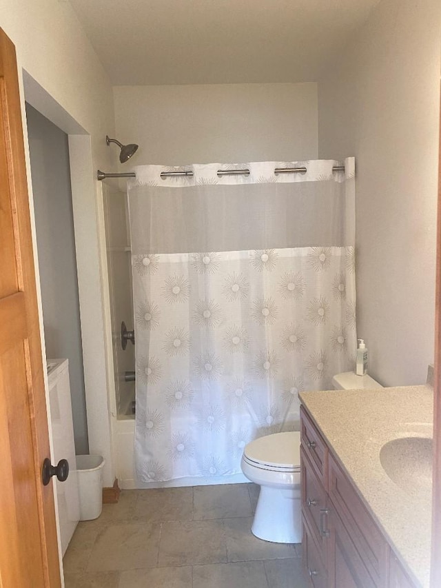 bathroom featuring vanity, tile patterned flooring, shower / bath combination with curtain, and toilet