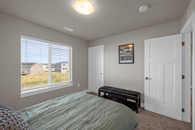 carpeted bedroom with visible vents