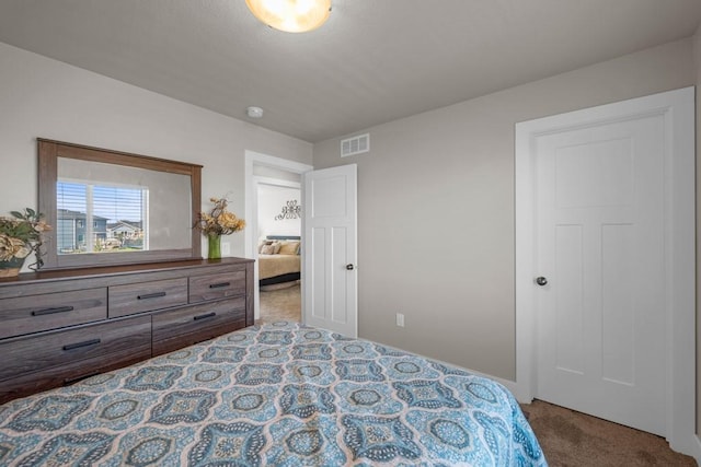 bedroom with carpet floors and visible vents