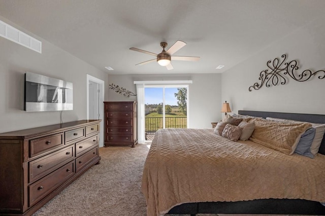 bedroom featuring access to outside, light colored carpet, ceiling fan, and visible vents