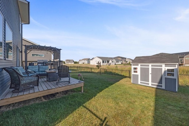 view of yard with a pergola, a shed, a residential view, an outdoor structure, and a wooden deck