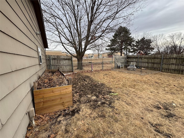 view of yard with fence private yard and a garden