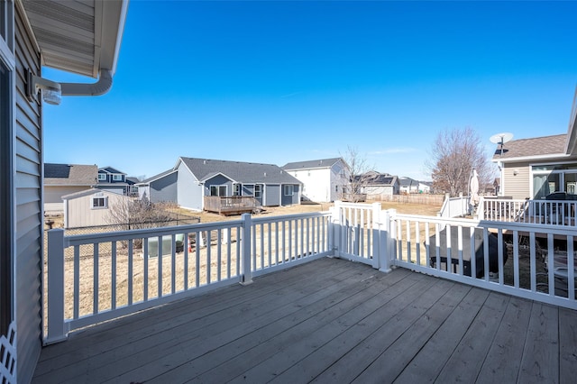 wooden deck featuring a residential view