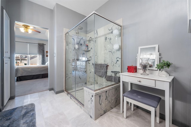 full bathroom with a marble finish shower, a ceiling fan, and connected bathroom