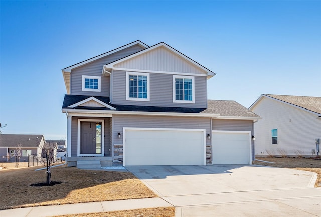 view of front of property featuring stone siding, concrete driveway, board and batten siding, and a garage