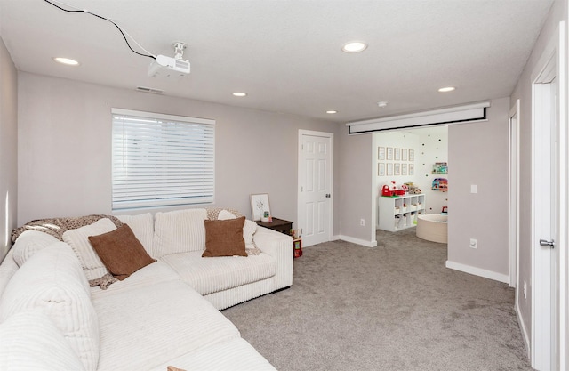 living room featuring recessed lighting, light carpet, and baseboards