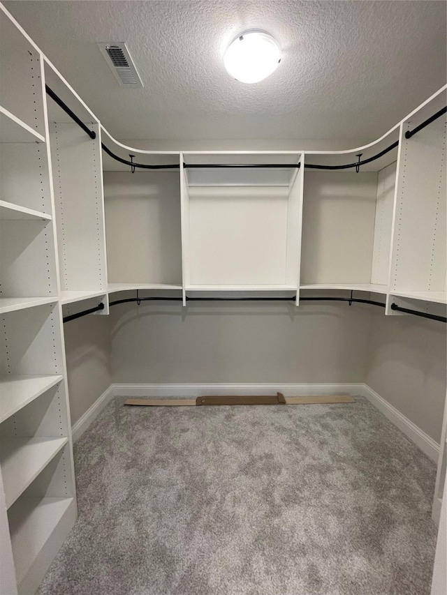 spacious closet with carpet and visible vents