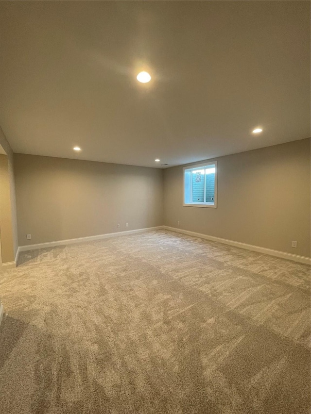 basement with recessed lighting, carpet flooring, and baseboards