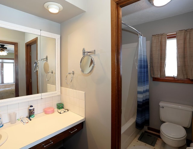 full bath featuring tasteful backsplash, toilet, vanity, and shower / bathtub combination with curtain