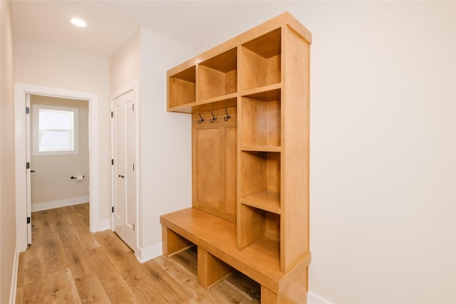 mudroom featuring recessed lighting, light wood-type flooring, and baseboards