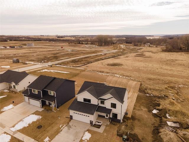 birds eye view of property with a rural view