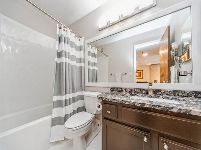 full bathroom with shower / bath combo, vanity, and toilet