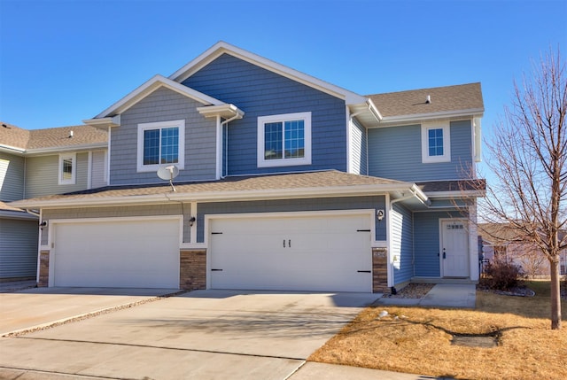 view of front of house featuring an attached garage and concrete driveway