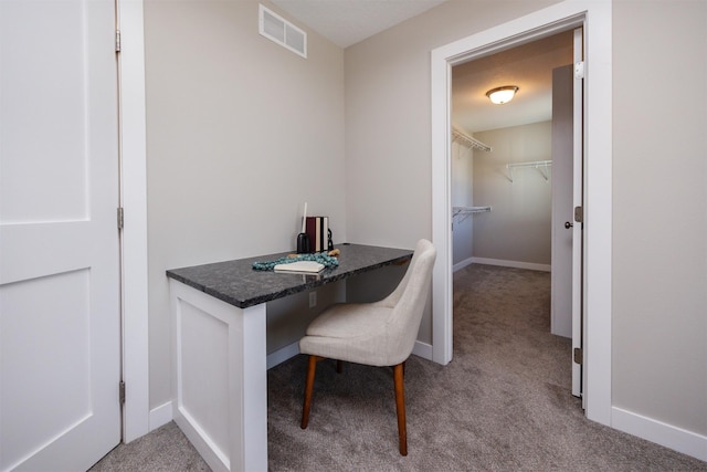 office area with light carpet, baseboards, and visible vents