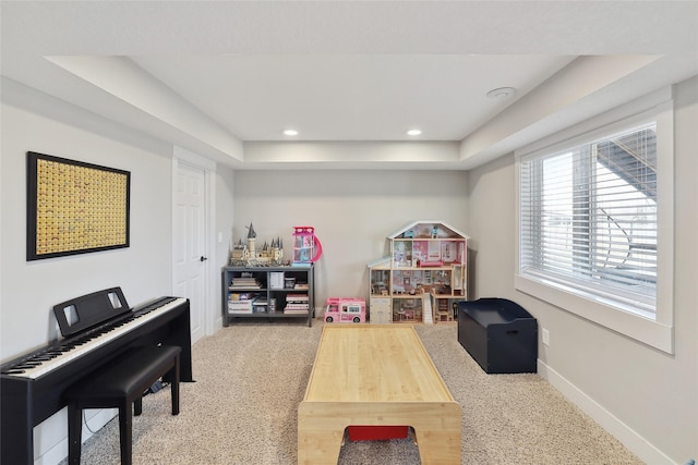 playroom with recessed lighting, a raised ceiling, carpet flooring, and baseboards