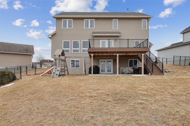 back of house with a yard, stairway, a fenced backyard, and a wooden deck