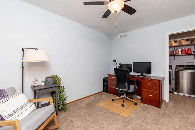 office with washing machine and dryer, light carpet, a ceiling fan, visible vents, and baseboards