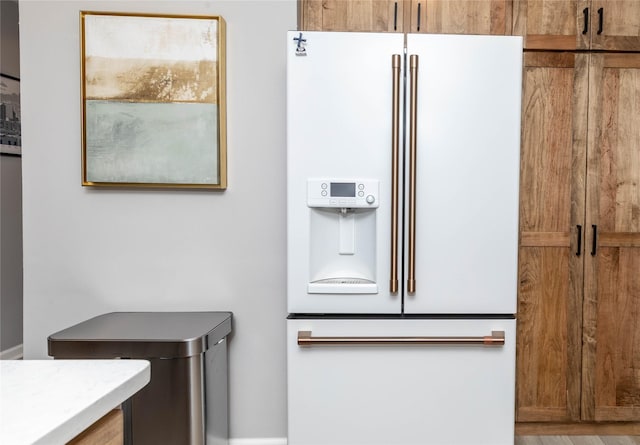 details featuring white fridge with ice dispenser