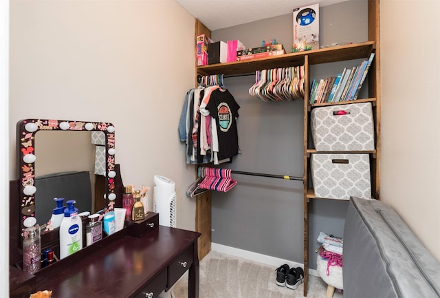 spacious closet featuring carpet floors