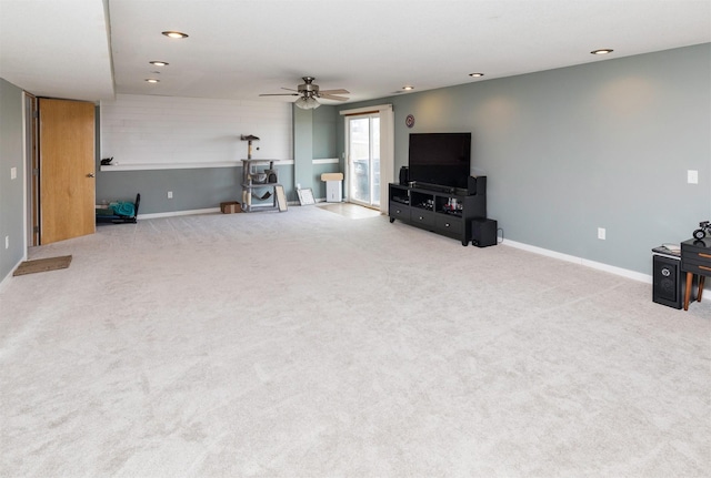 carpeted living area with a ceiling fan, recessed lighting, and baseboards