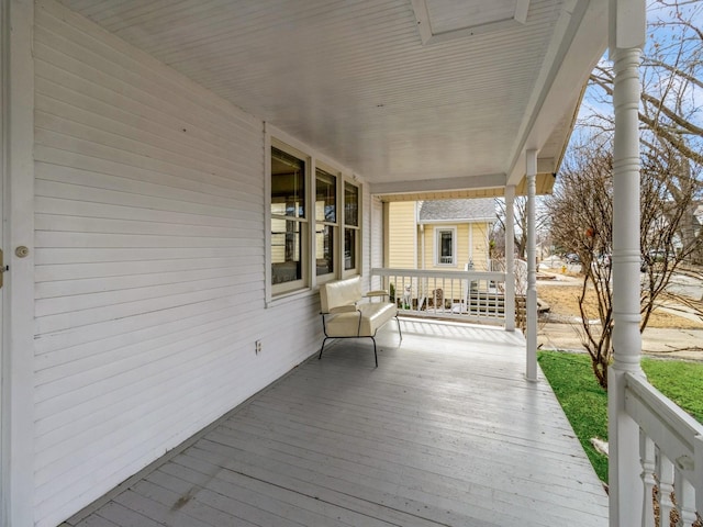 wooden terrace featuring a porch