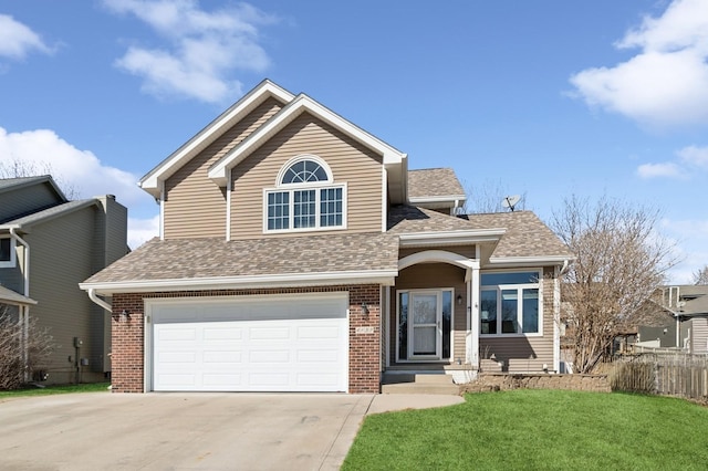 traditional-style home featuring concrete driveway, roof with shingles, an attached garage, a front lawn, and brick siding