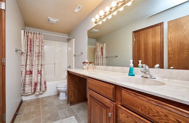 bathroom with toilet, a textured ceiling, vanity, and visible vents