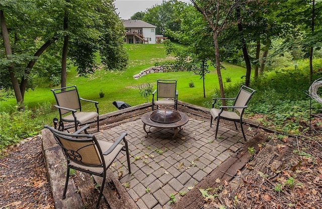 3302 SW Edgewood Ln, Ankeny, IA 50023 - view of patio with a fire pit