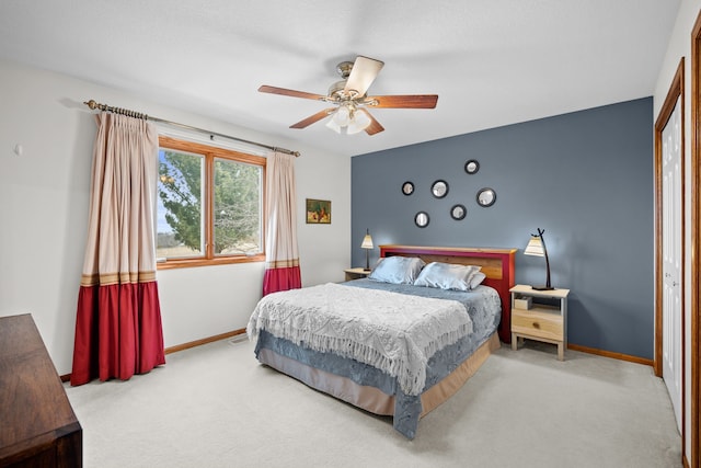 bedroom featuring ceiling fan, baseboards, and carpet flooring