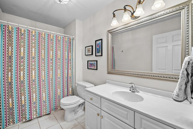 full bathroom featuring a shower with curtain, toilet, vanity, a textured ceiling, and tile patterned flooring