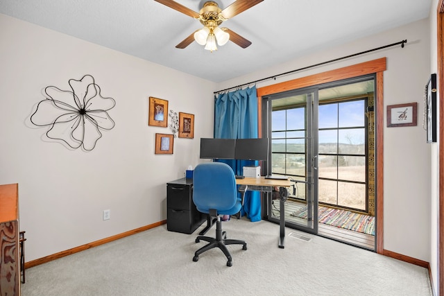 office area with a ceiling fan, baseboards, visible vents, and carpet flooring