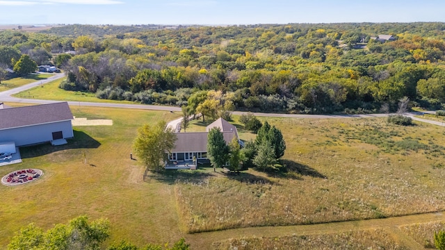 birds eye view of property with a forest view