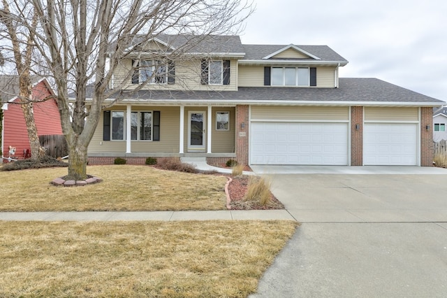 traditional-style house featuring a shingled roof, brick siding, driveway, and a front lawn